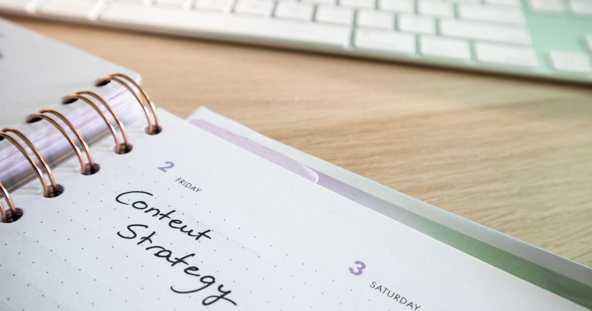 Handwritten workout dates in a planner, the kind of note Gym Note Plus date recognition reads and matches to a workout